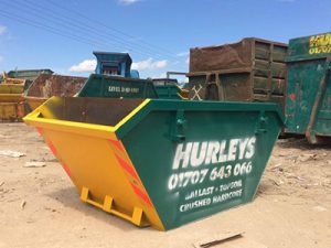 An image of a large skip with 'Hurley's' written on the side